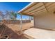 A covered patio area provides a shady spot in the backyard at 1940 S Coconino Dr, Apache Junction, AZ 85120