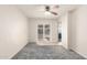 This bedroom has carpeted floor and a sliding glass door that opens to the back patio at 1940 S Coconino Dr, Apache Junction, AZ 85120