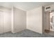 A cozy bedroom featuring neutral colored walls, wall closet and connecting bathroom at 1940 S Coconino Dr, Apache Junction, AZ 85120