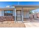 Charming single-story home featuring a rock facade and a covered carport at 1940 S Coconino Dr, Apache Junction, AZ 85120