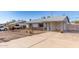 Charming single-story home featuring a rock facade and a covered carport at 1940 S Coconino Dr, Apache Junction, AZ 85120