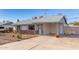 Charming single-story home featuring a rock facade and a covered carport at 1940 S Coconino Dr, Apache Junction, AZ 85120