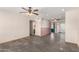 A spacious living room boasts slate floors and multiple ceiling fans for comfort at 1940 S Coconino Dr, Apache Junction, AZ 85120