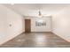 A bright living room features a window, a ceiling fan, and slate flooring at 1940 S Coconino Dr, Apache Junction, AZ 85120