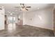 A spacious living room boasts slate floors and multiple ceiling fans for comfort at 1940 S Coconino Dr, Apache Junction, AZ 85120