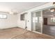 An enclosed patio with sliding glass doors and a ceiling fan at 1940 S Coconino Dr, Apache Junction, AZ 85120