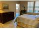 Bedroom with a queen-size bed and access to a patio at 20100 N 78Th Pl # 1092, Scottsdale, AZ 85255