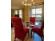 Elegant dining area with a glass-top table and modern chandelier at 20100 N 78Th Pl # 1092, Scottsdale, AZ 85255