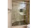 Large walk-in shower with glass enclosure and bench at 20100 N 78Th Pl # 1092, Scottsdale, AZ 85255