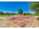 Outdoor basketball court with clear lines and a hoop at 20652 N Wishing Well Ln, Maricopa, AZ 85138