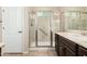 Bathroom with a walk-in shower, modern vanity, and tiled flooring at 20652 N Wishing Well Ln, Maricopa, AZ 85138