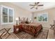 Bright bedroom with a comfortable bed and plantation shutters at 20652 N Wishing Well Ln, Maricopa, AZ 85138