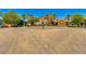 Grand entrance to community with fountain and Mediterranean style architecture at 20652 N Wishing Well Ln, Maricopa, AZ 85138