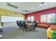 Modern conference room with large table and whiteboard at 20652 N Wishing Well Ln, Maricopa, AZ 85138