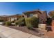 House exterior showcasing side yard and landscaping at 20652 N Wishing Well Ln, Maricopa, AZ 85138