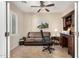 Home office featuring a built-in desk and comfortable seating at 20652 N Wishing Well Ln, Maricopa, AZ 85138