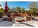 Lovely patio with a fire pit and comfortable seating at 20652 N Wishing Well Ln, Maricopa, AZ 85138