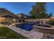 Relaxing backyard oasis featuring a sparkling pool, spa, and lounge area at 23219 N 41St St, Phoenix, AZ 85050