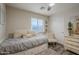 Comfortable bedroom with built-in drawers and sitting chair at 23219 N 41St St, Phoenix, AZ 85050