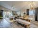 Open concept living and dining area with farmhouse style table and bench at 23219 N 41St St, Phoenix, AZ 85050