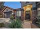 Elegant front entrance with stone accents and a welcoming door at 23219 N 41St St, Phoenix, AZ 85050