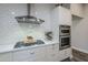 Close-up of kitchen with white cabinets, stainless steel appliances, and white subway tile at 23219 N 41St St, Phoenix, AZ 85050