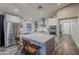 Modern kitchen with white cabinets, stainless steel appliances, and an island at 23219 N 41St St, Phoenix, AZ 85050