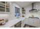 Kitchen features white cabinets, subway tile, and a farmhouse sink at 23219 N 41St St, Phoenix, AZ 85050