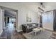 Open living area with hardwood floors and a view into the kitchen at 23219 N 41St St, Phoenix, AZ 85050