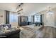 Bright and airy living room with a large sectional sofa and a modern chandelier at 23219 N 41St St, Phoenix, AZ 85050