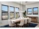 Elegant dining room with a large wooden table and chandelier at 23766 N 123Rd Way, Scottsdale, AZ 85255