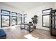 Bright home office with large windows and wood desk at 23766 N 123Rd Way, Scottsdale, AZ 85255