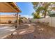 Landscaped backyard with a stone pathway and gravel at 25636 S Howard Dr, Sun Lakes, AZ 85248