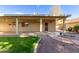 Home exterior with covered patio and landscaped backyard at 25636 S Howard Dr, Sun Lakes, AZ 85248