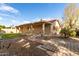 Home exterior showcasing a backyard with a stone path at 25636 S Howard Dr, Sun Lakes, AZ 85248