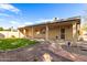 Home exterior with covered patio and landscaped backyard at 25636 S Howard Dr, Sun Lakes, AZ 85248