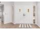 Bright entryway with double white doors and tile flooring at 25636 S Howard Dr, Sun Lakes, AZ 85248