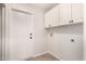 Laundry room with cabinets and exterior access at 25636 S Howard Dr, Sun Lakes, AZ 85248