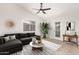 Bright living room with sectional sofa and stylish decor at 25636 S Howard Dr, Sun Lakes, AZ 85248