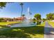 Picturesque waterfront view with fountain and homes at 25636 S Howard Dr, Sun Lakes, AZ 85248