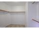 Walk-in closet with wood shelving and hanging rods at 2828 E Blackhawk Dr, Phoenix, AZ 85050