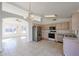 Kitchen with light wood cabinets, stainless steel appliances, and an open floor plan at 2828 E Blackhawk Dr, Phoenix, AZ 85050