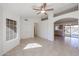 Bright and airy living room with tile floors and a view into the kitchen at 2828 E Blackhawk Dr, Phoenix, AZ 85050