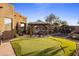 Backyard putting green and patio with gazebo at 30014 N Baker Ct, Scottsdale, AZ 85262