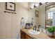 Bathroom with a single vanity and a large mirror at 30014 N Baker Ct, Scottsdale, AZ 85262