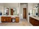 Double vanity bathroom with ample storage and a large mirror at 30014 N Baker Ct, Scottsdale, AZ 85262