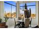 Bright breakfast nook with scenic views and elegant dining seating at 30014 N Baker Ct, Scottsdale, AZ 85262