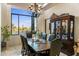 Bright dining room with large window and formal dining table at 30014 N Baker Ct, Scottsdale, AZ 85262