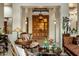 Grand entryway with double wood doors and ornate furniture at 30014 N Baker Ct, Scottsdale, AZ 85262