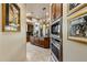 Gourmet kitchen with double ovens, granite counters, and island at 30014 N Baker Ct, Scottsdale, AZ 85262